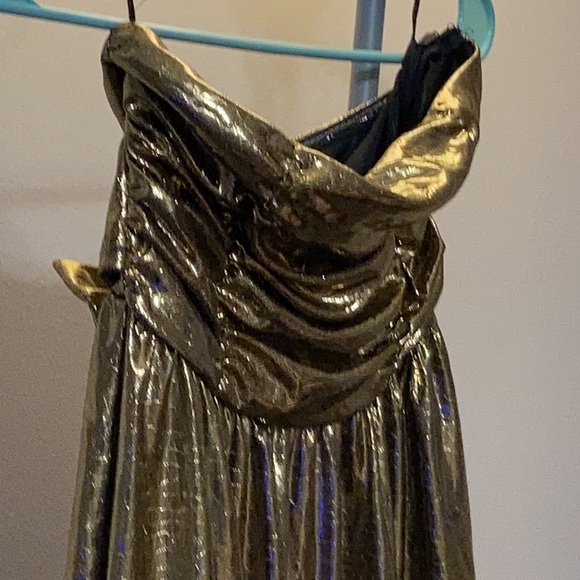 Gold shiny strapless dress with bow on back. - Picture 2 of 3